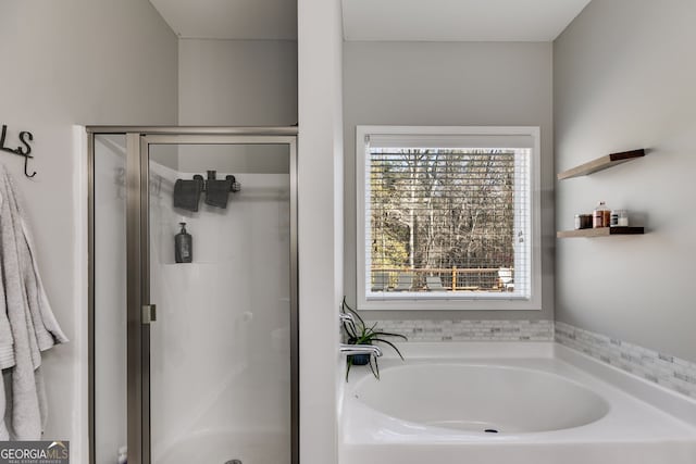 bathroom featuring plus walk in shower