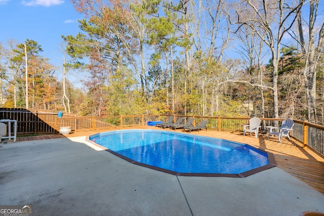 view of swimming pool featuring a wooden deck