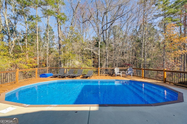 view of pool featuring a wooden deck