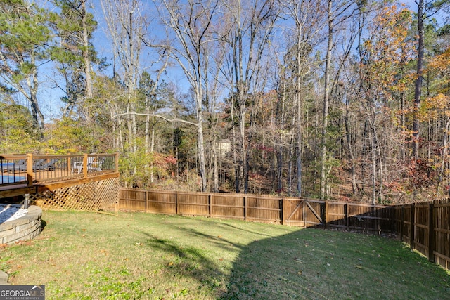 view of yard with a wooden deck