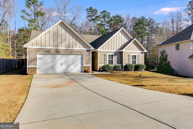 view of front of house featuring a garage and a front yard