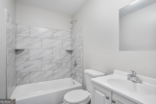 full bathroom featuring toilet, vanity, and tiled shower / bath combo