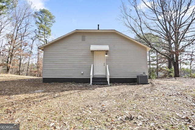 rear view of property with central air condition unit