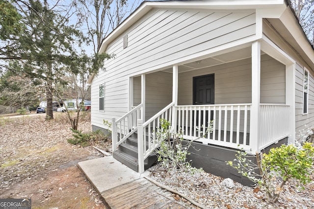 doorway to property with covered porch