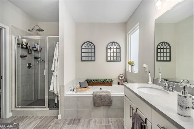 bathroom with vanity and plus walk in shower