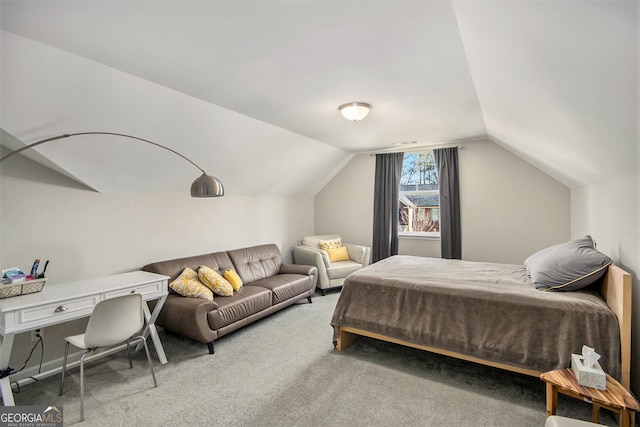 carpeted bedroom featuring lofted ceiling