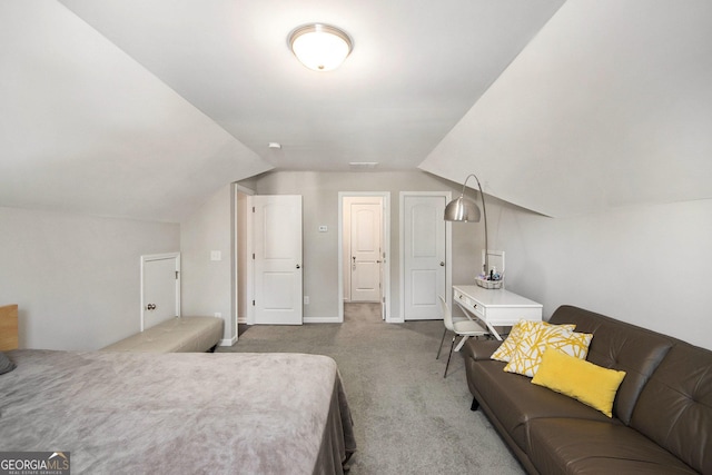 bedroom featuring carpet flooring and lofted ceiling