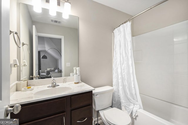 full bathroom with shower / tub combo, vanity, and toilet