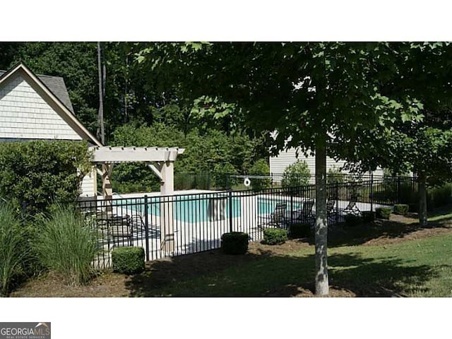 view of swimming pool featuring a pergola