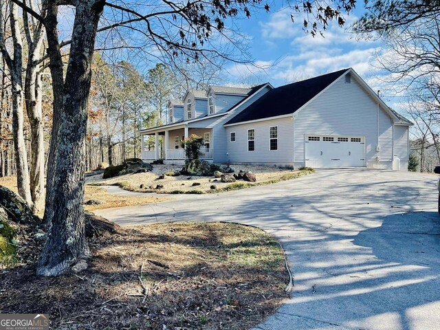 view of home's exterior featuring a garage and a yard