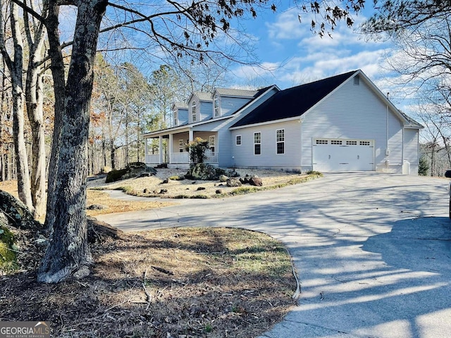 view of front of home featuring a garage and a porch