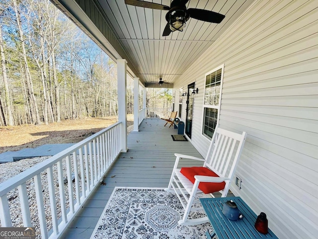 deck featuring ceiling fan and a porch