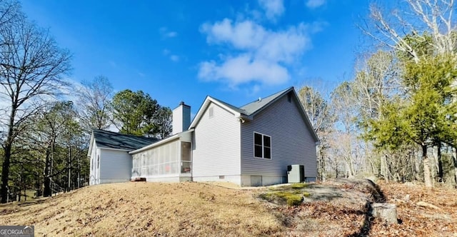 view of property exterior featuring a sunroom