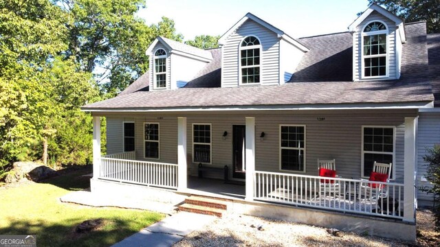 cape cod home with covered porch