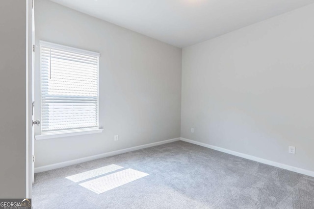 carpeted empty room with a wealth of natural light