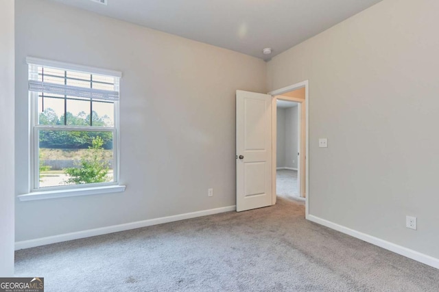 empty room featuring light colored carpet