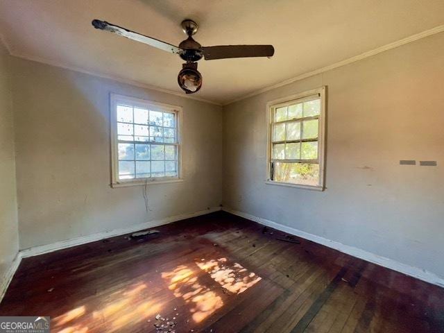 unfurnished room featuring ornamental molding, ceiling fan, and dark hardwood / wood-style flooring