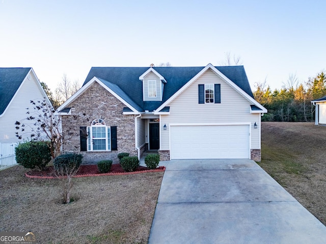 view of front of house with a garage and a front lawn