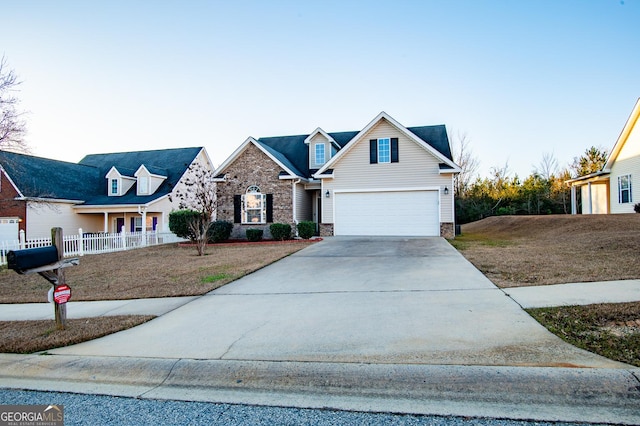 view of front of house featuring a porch, a garage, and a front lawn