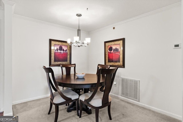 dining room featuring light carpet, a notable chandelier, and ornamental molding