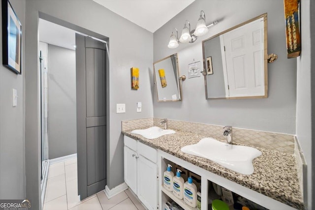 bathroom with tile patterned flooring and vanity