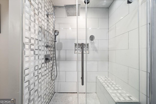 bathroom with tiled shower