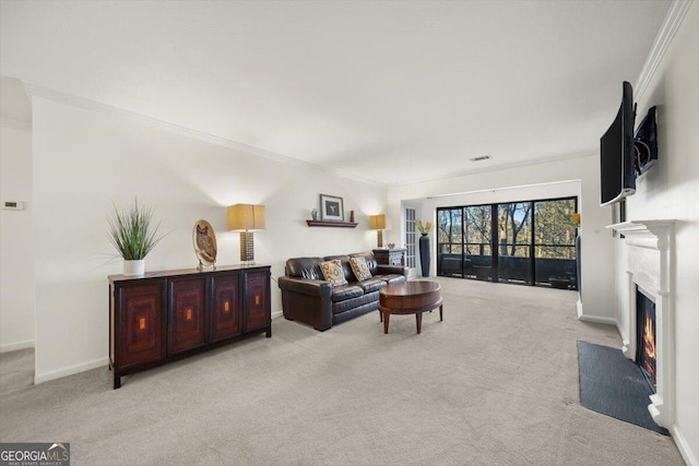 carpeted living room featuring crown molding