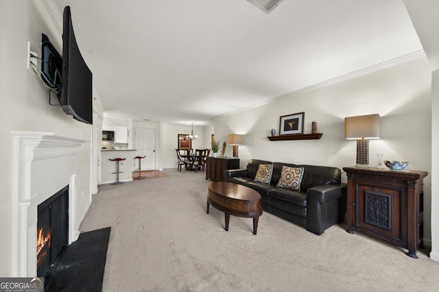 living room with light carpet and ornamental molding