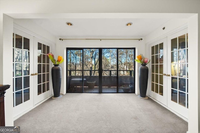 unfurnished sunroom with french doors