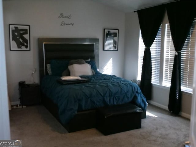 bedroom featuring light colored carpet