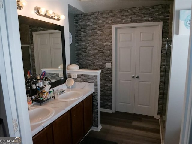 bathroom with vanity and hardwood / wood-style flooring