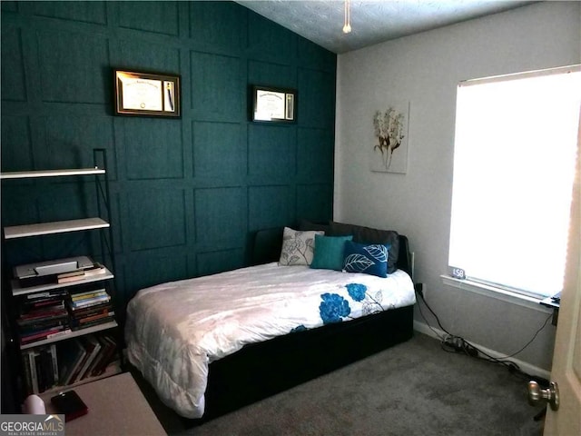 carpeted bedroom featuring lofted ceiling