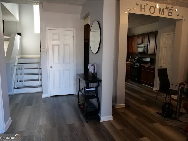 hallway with dark wood-type flooring