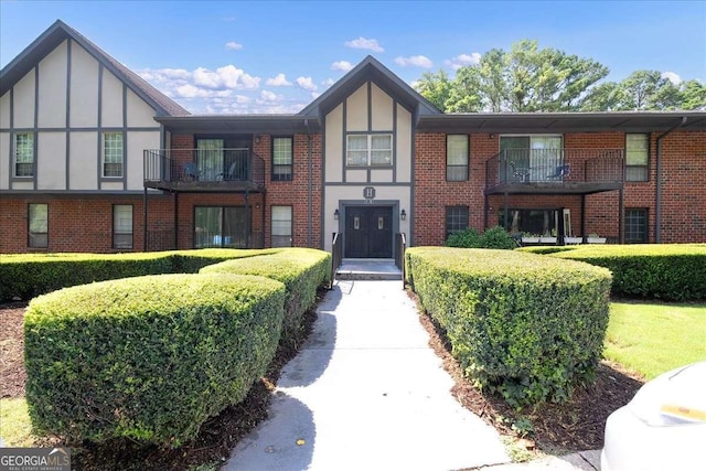 view of front of property with a balcony