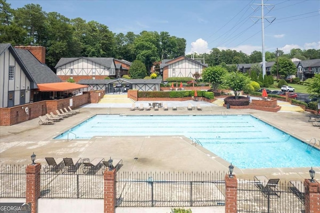 view of swimming pool with a patio