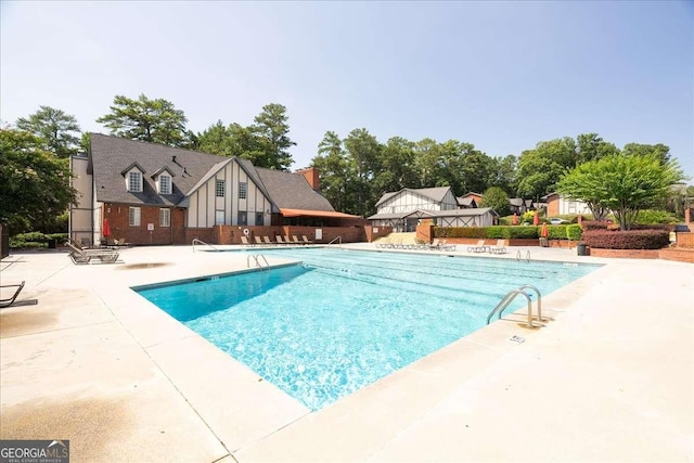 view of pool featuring a patio