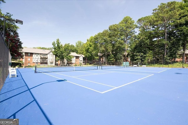 view of tennis court with basketball court