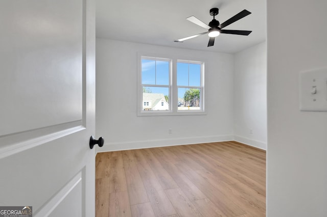 empty room featuring ceiling fan and light hardwood / wood-style floors