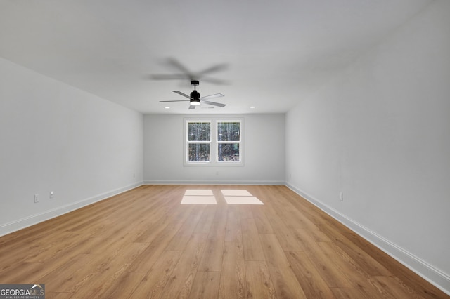 unfurnished room featuring ceiling fan and light hardwood / wood-style flooring