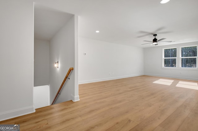 unfurnished room with light hardwood / wood-style floors and ceiling fan