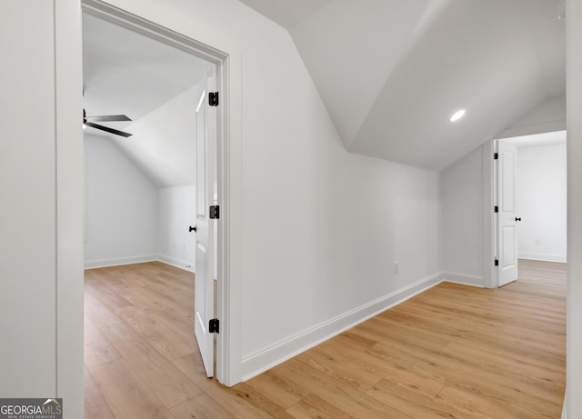 additional living space with lofted ceiling, ceiling fan, and light hardwood / wood-style flooring