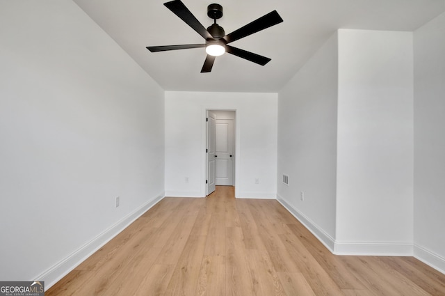 empty room with ceiling fan and light wood-type flooring