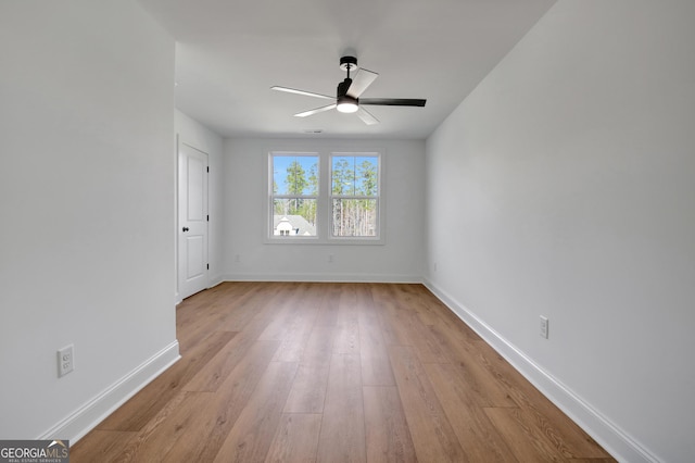 unfurnished room with ceiling fan and light hardwood / wood-style floors