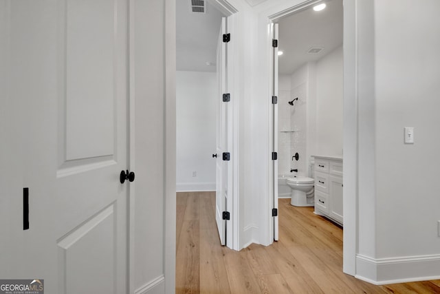 hallway featuring light hardwood / wood-style floors