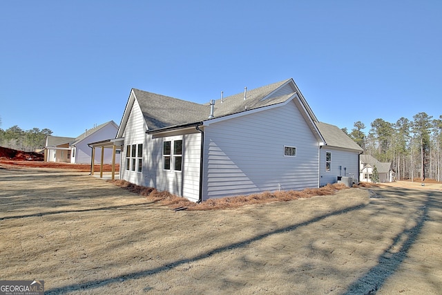 view of side of home featuring a lawn