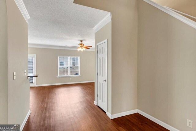 unfurnished living room featuring ornamental molding