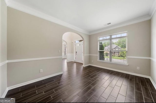 spare room featuring crown molding