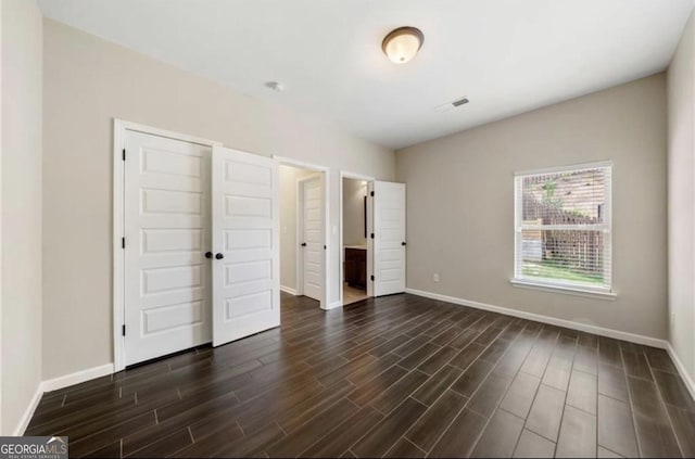 unfurnished bedroom with a closet