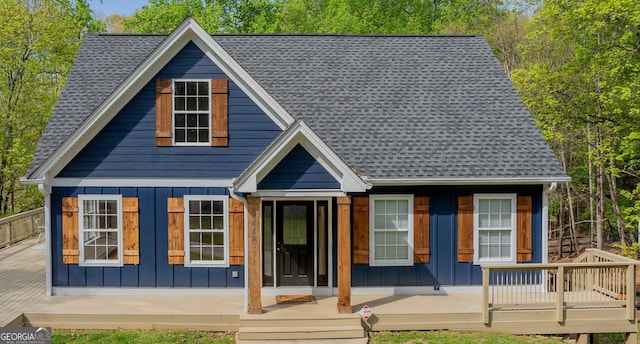 rear view of property with covered porch