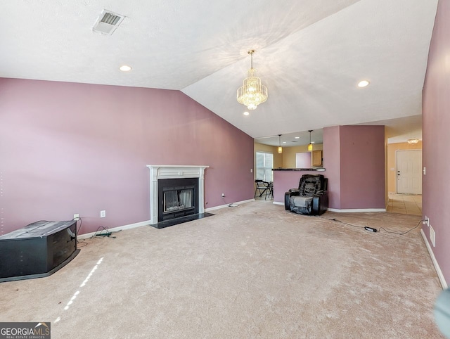 unfurnished living room with carpet flooring, vaulted ceiling, and a chandelier